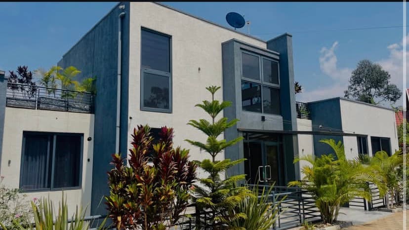Agasaro Luxe Apartment exterior at sunset